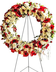 Brillante corona funeraria de flores mixtas