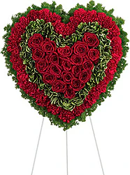 Corona funeraria de rosas rojas y claveles